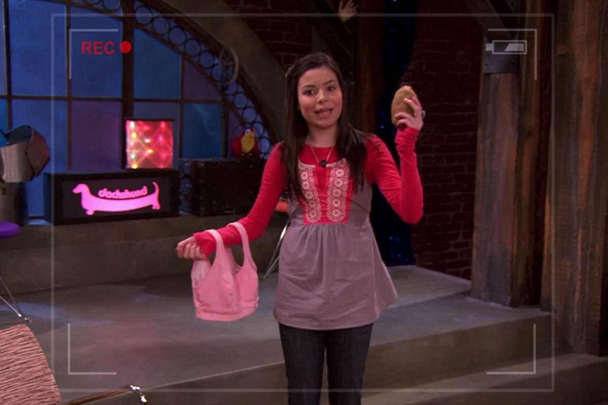 Carly holding a potato and a sports bra